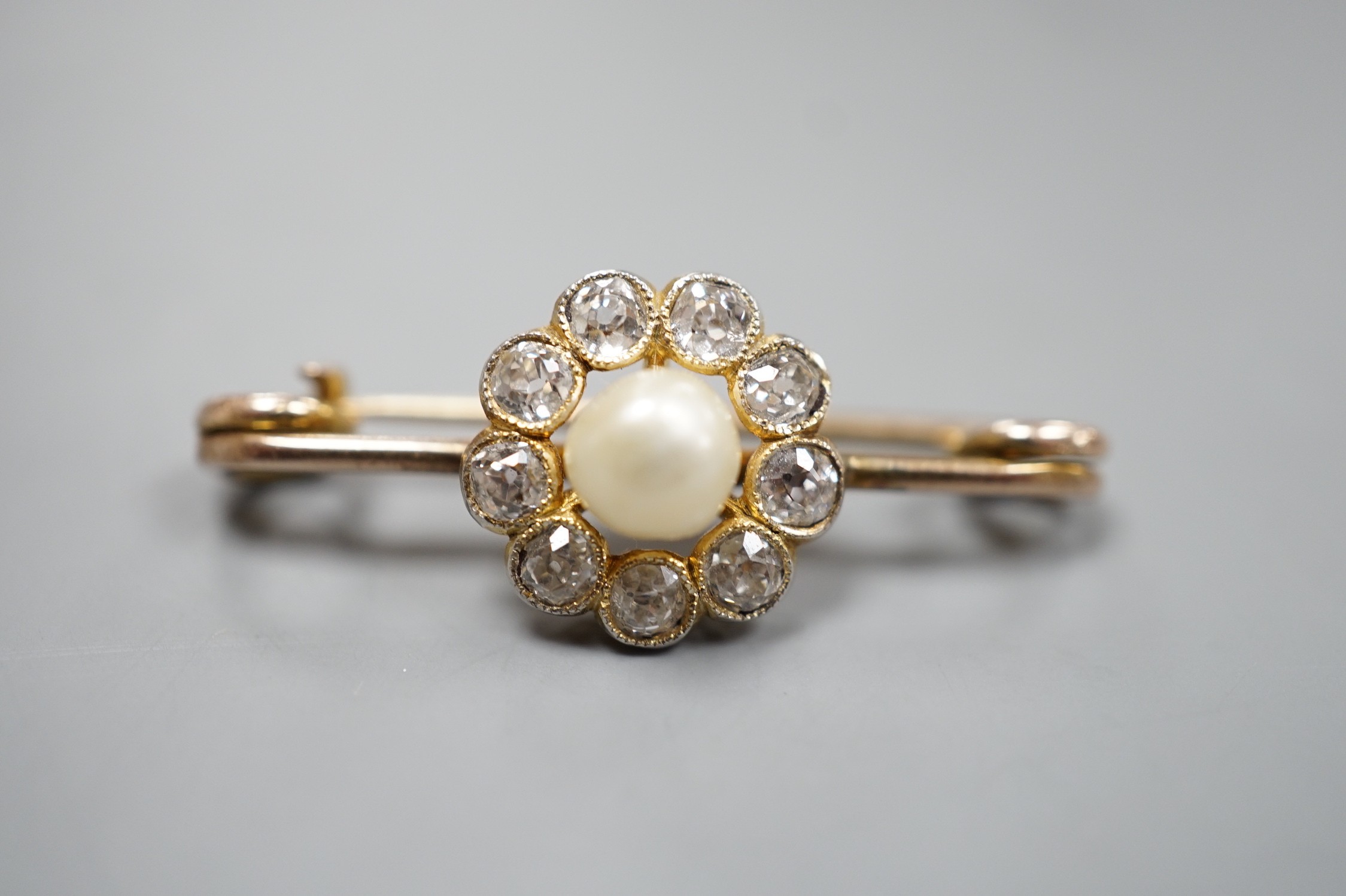 A yellow metal, cultured pearl and diamond cluster set bar brooch, 31mm, gross weight 2.7 grams.